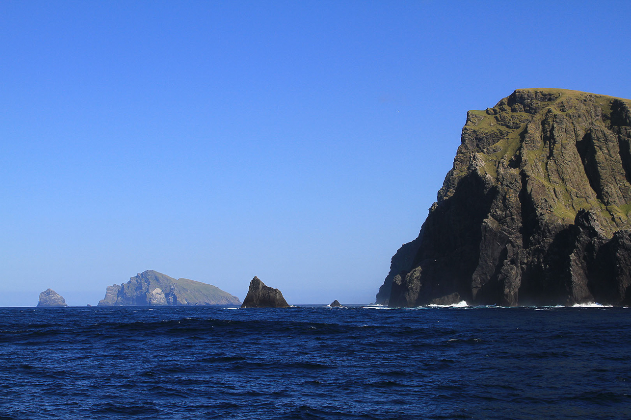 The rocks of St Kilda and surrounding cliffs, with Boreray and the stacs at the background. People climbed the cliffs for birds, eggs and feathers.