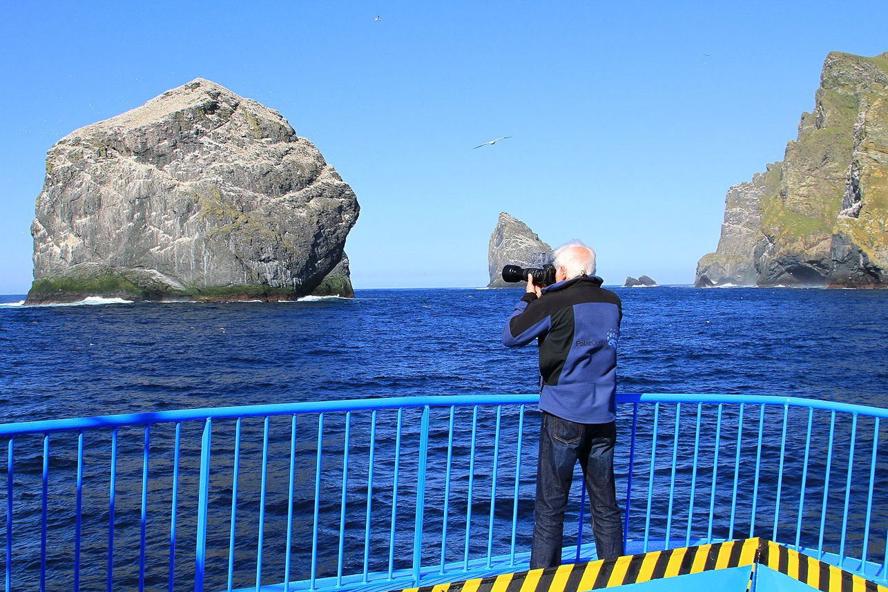 Approaching the cliff Stac Lee with the world largest colony of gannets