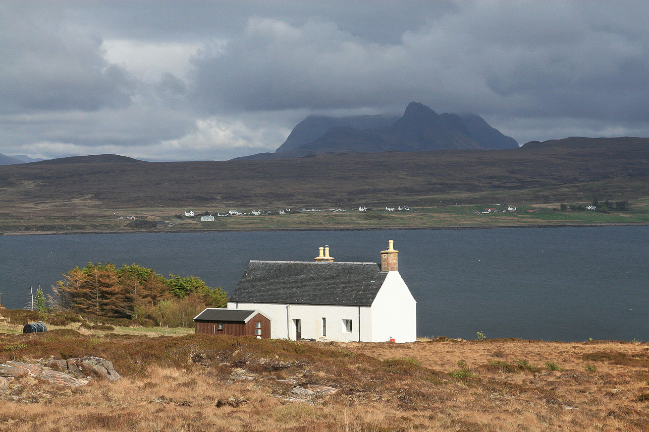 Tanera Mòr with the mountains on the main land at the back