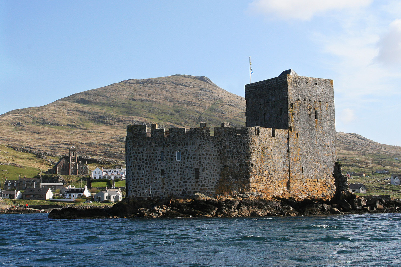 Kisimul medieval castle on a small island at Castlebay, Barra, seen from the bay.