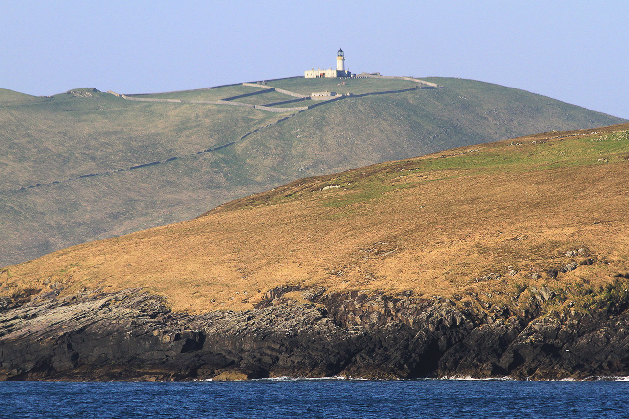 Lighthouse of Barra Head on Berneray, seen from Mingulay