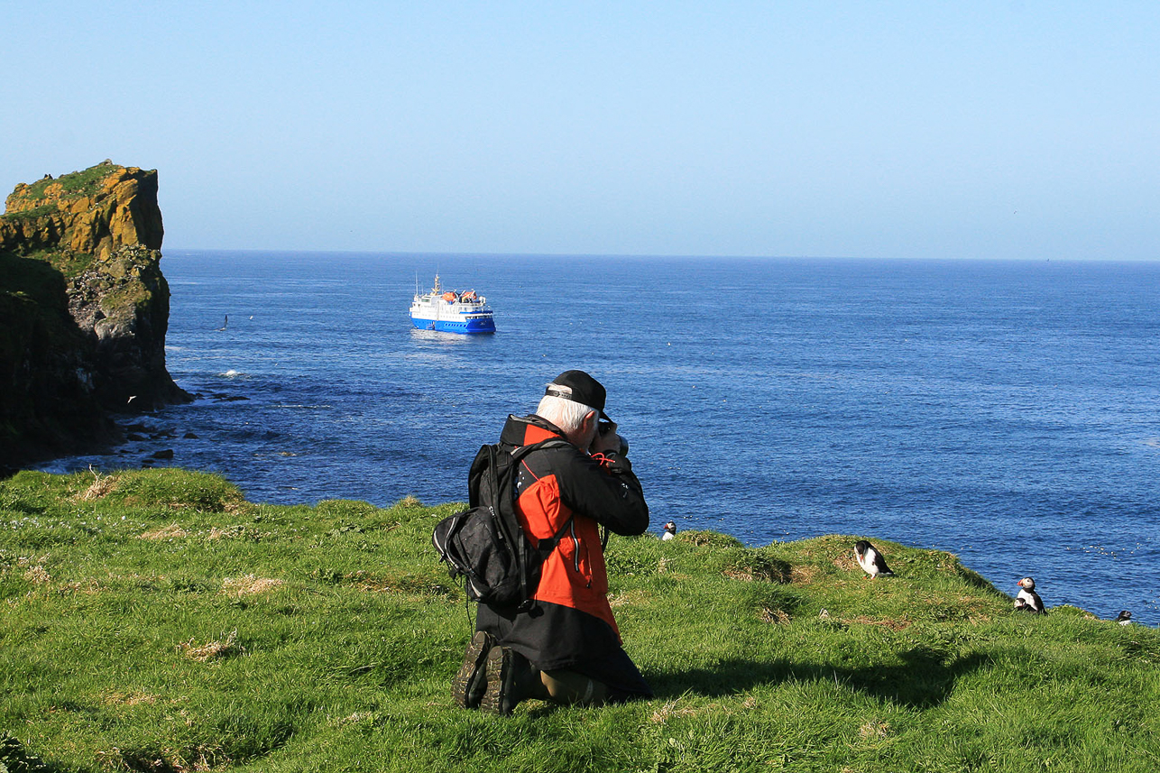 Olle watching puffins at Lunga