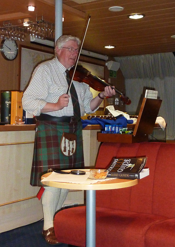 John Love, devoted to the nature of the Hebrides, playing violin