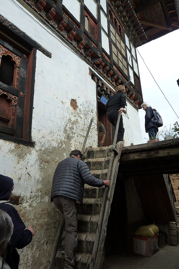 Traditional Bhutanese house with one or two floors for animals and storage, and the top floor for living.