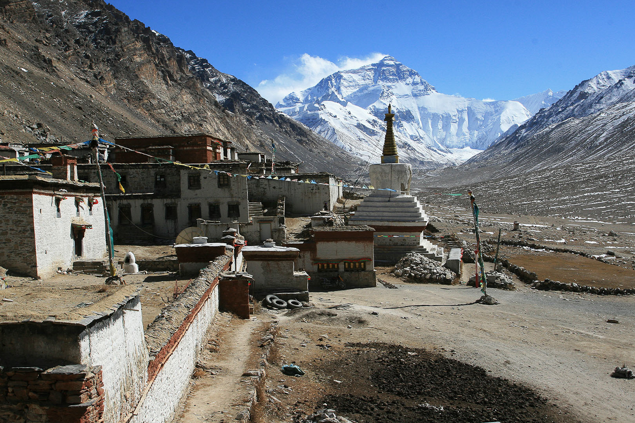 Rongbuk monastery at 5000 m, with Everest in the back. A monastery for both monks and nuns, causing some "problems".