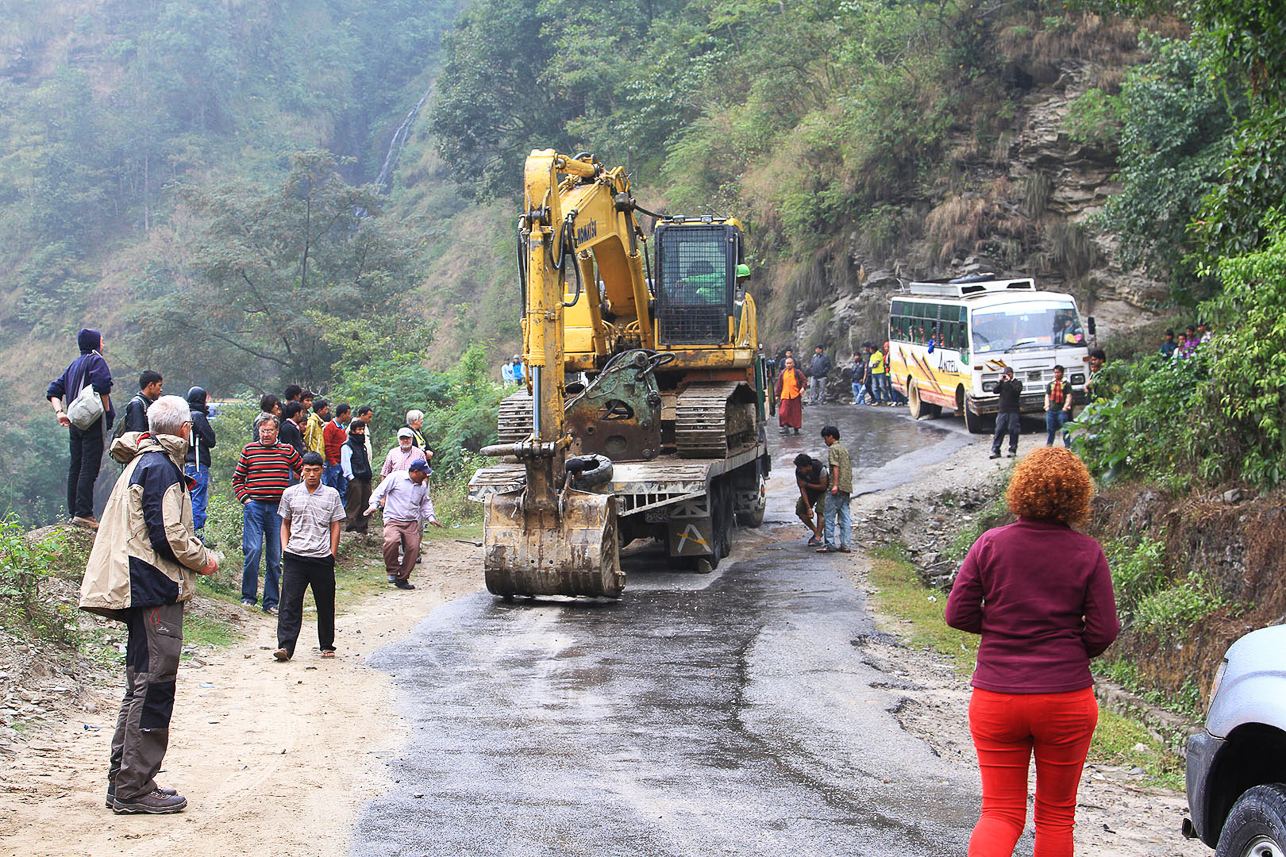 A machine blocks the continuation of the Friendship Highway (!) in Nepal. The road was not good.