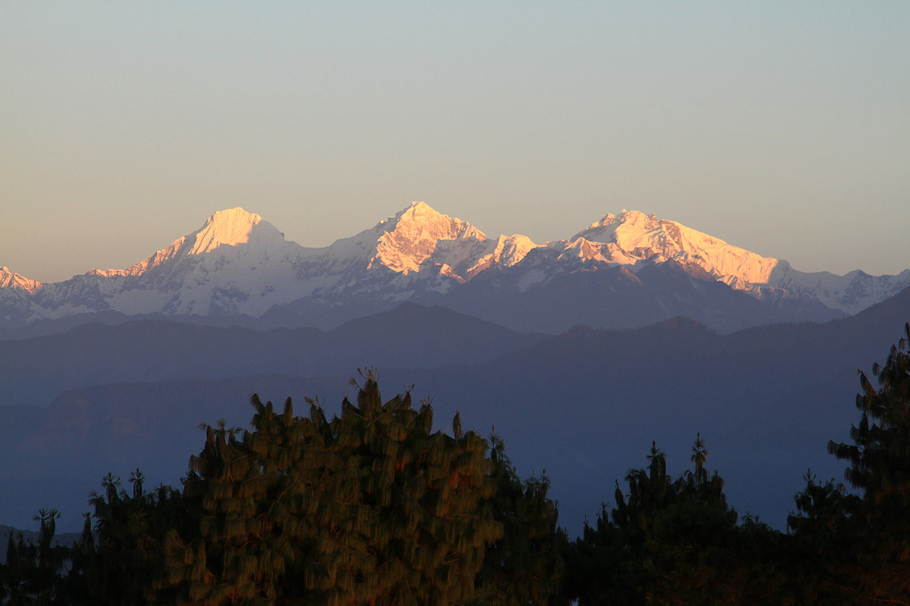 Morning sun hits the peaks.