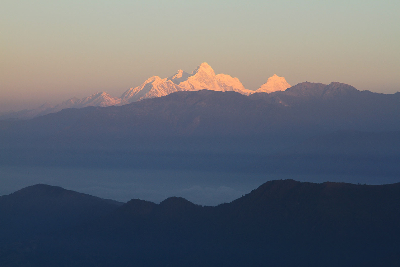 Morning sun hits the peaks.