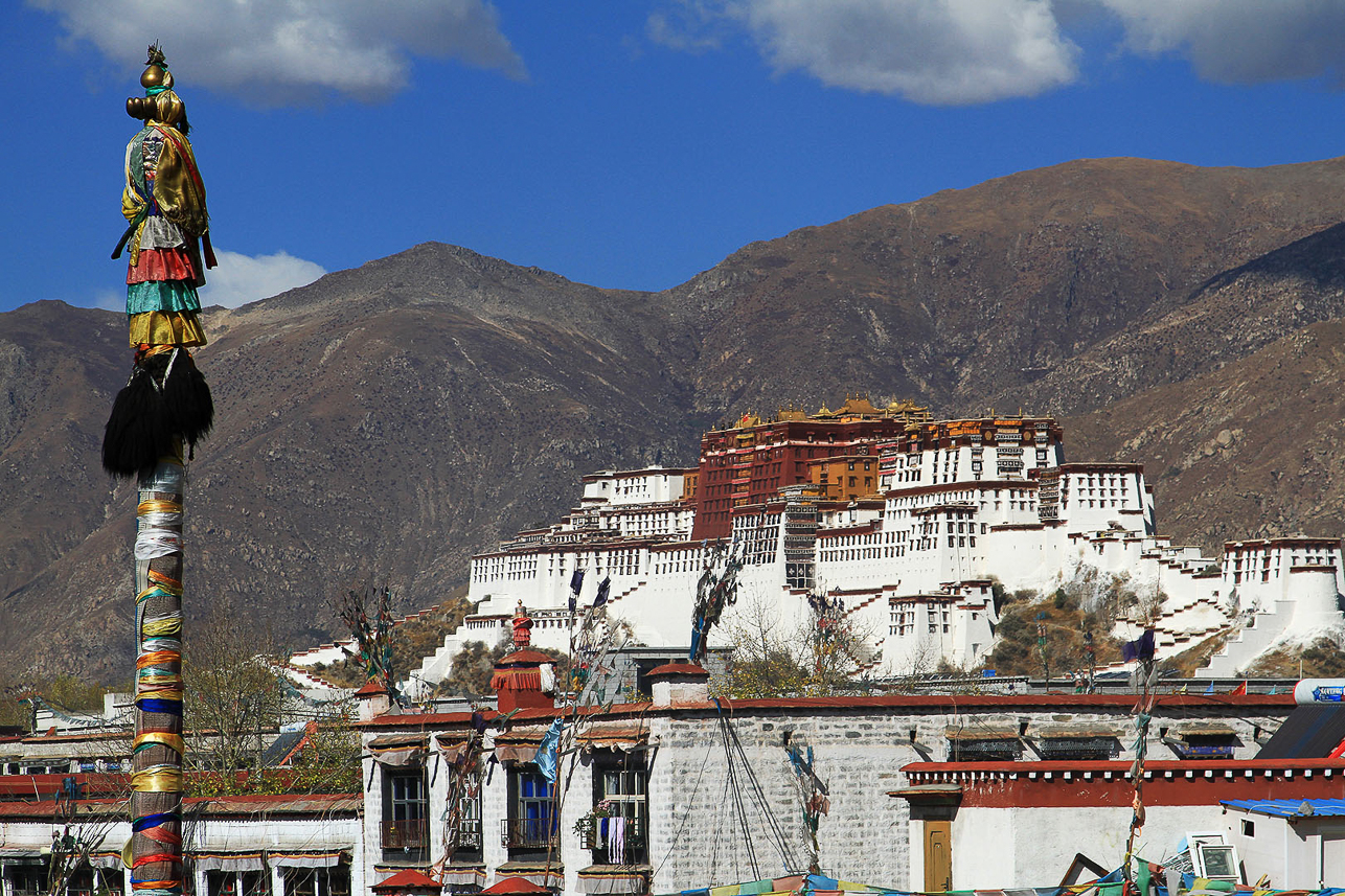 Potala palace with Dhavja (Victory banner poles) in front.