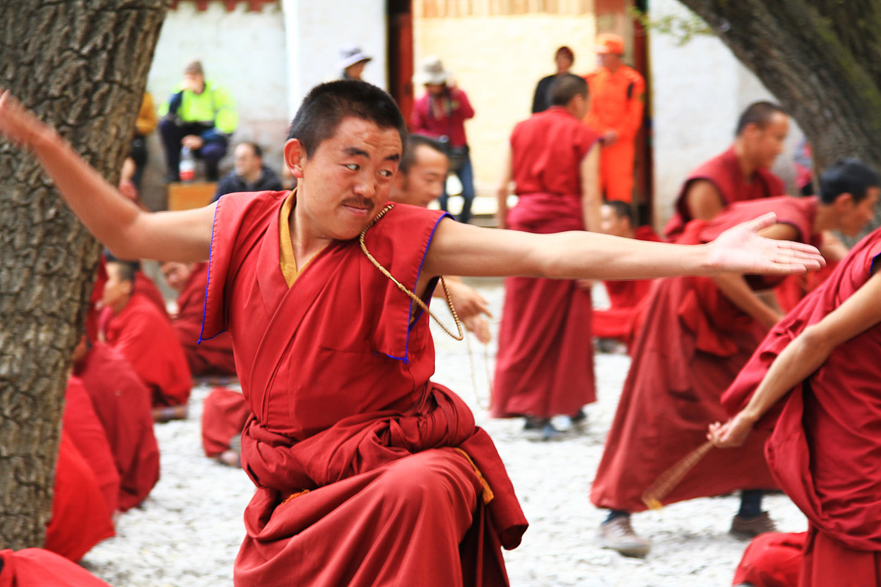 Monk debate at Sera Monastery, learning process in teaching Buddhism.