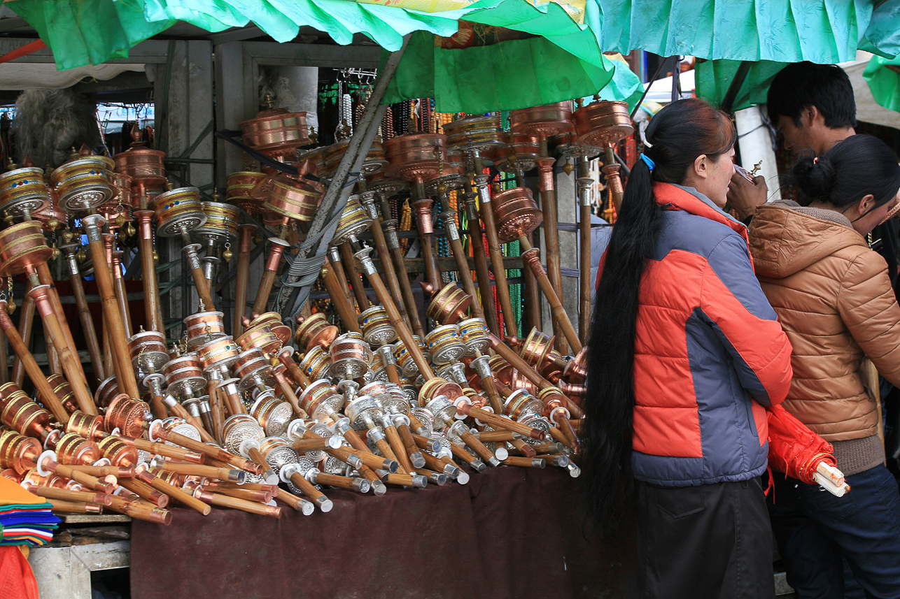 Prayer wheels for sale at Barkor Square.