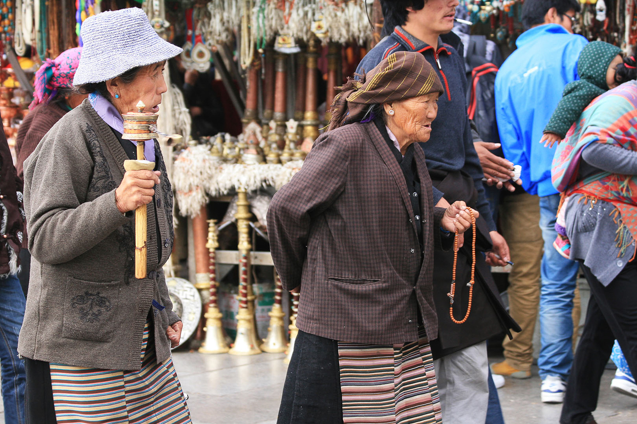 Old people performing the kora, walking around the Johkang temple.