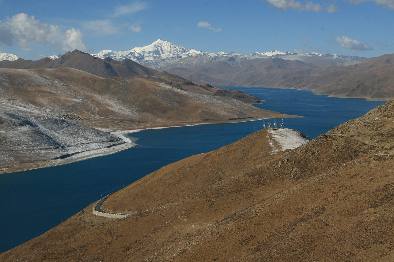 Yamdrok lake, one of four holy lakes in Tibet, on 4450 m height. Norin Kang mountain, 7200 m, in the background.