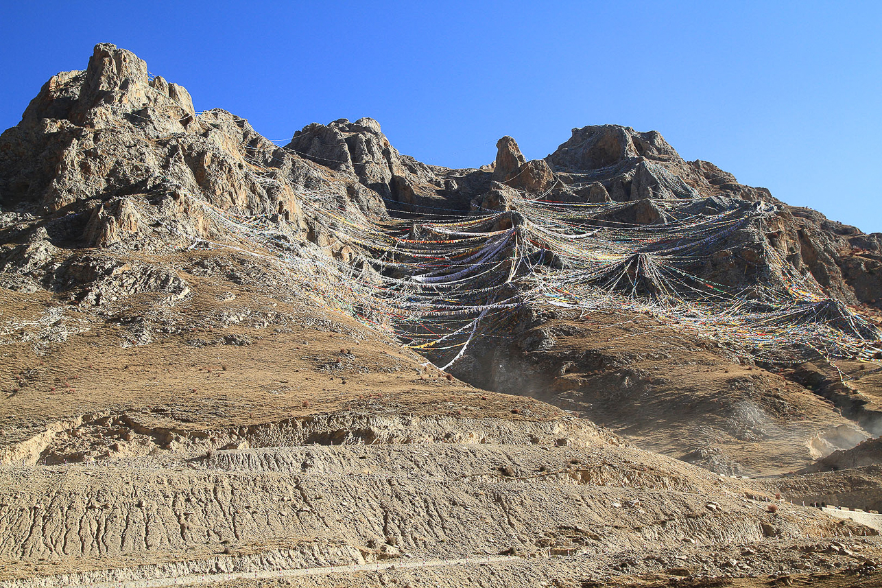 Prayer flags on the slope at Drak Yerpa.