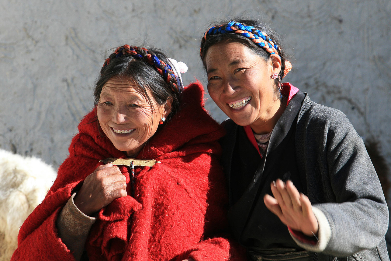 Tibetan woman, we were invited to the home of the woman to the right.