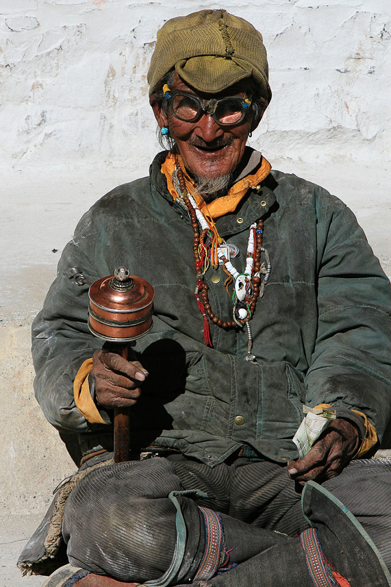 80-years old praying man at Shegar Dzong.