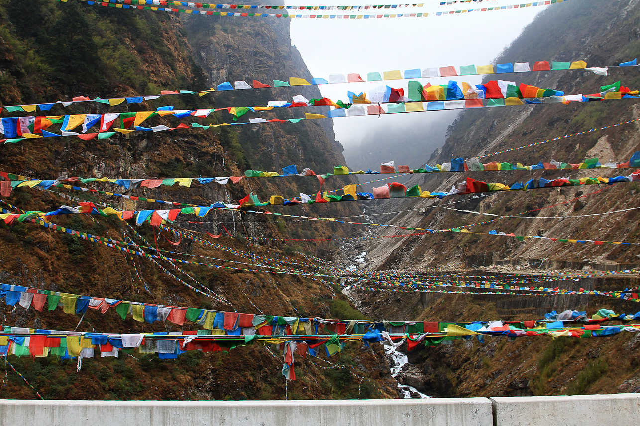 Prayer flags over Tibetan valley, close to the border of Nepal