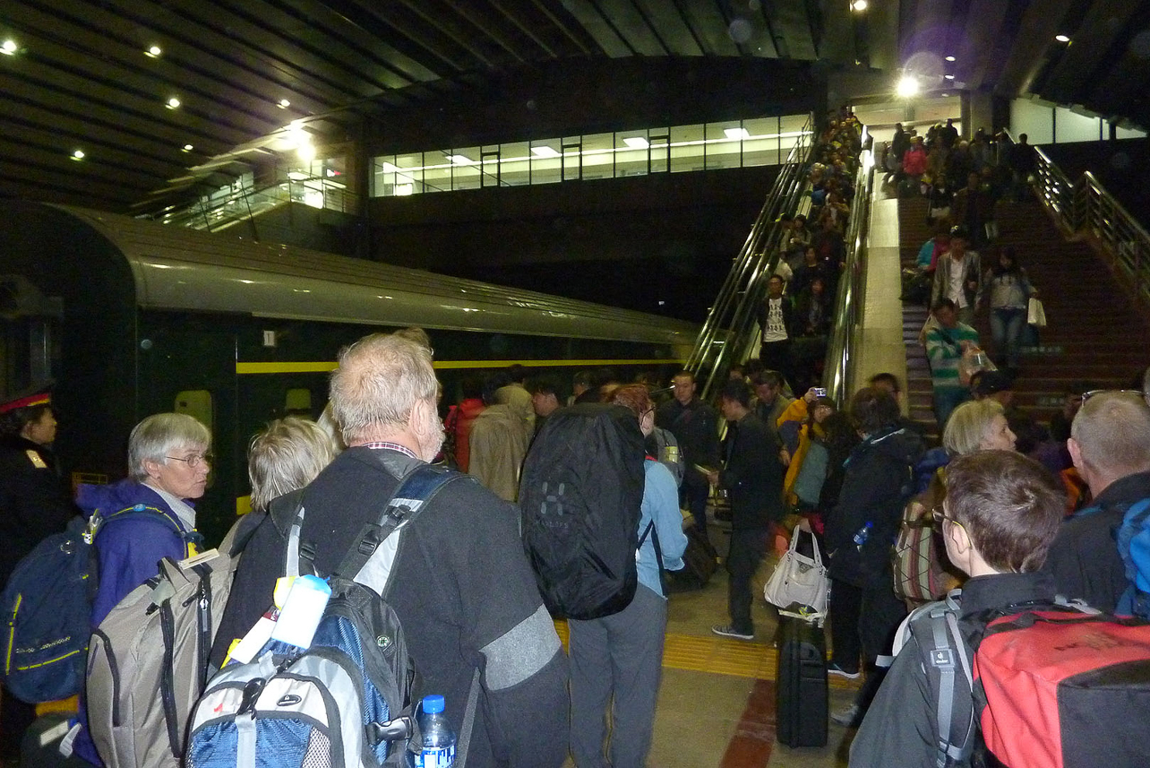 Crowded on Beijing train station, the train is ready for boarding.