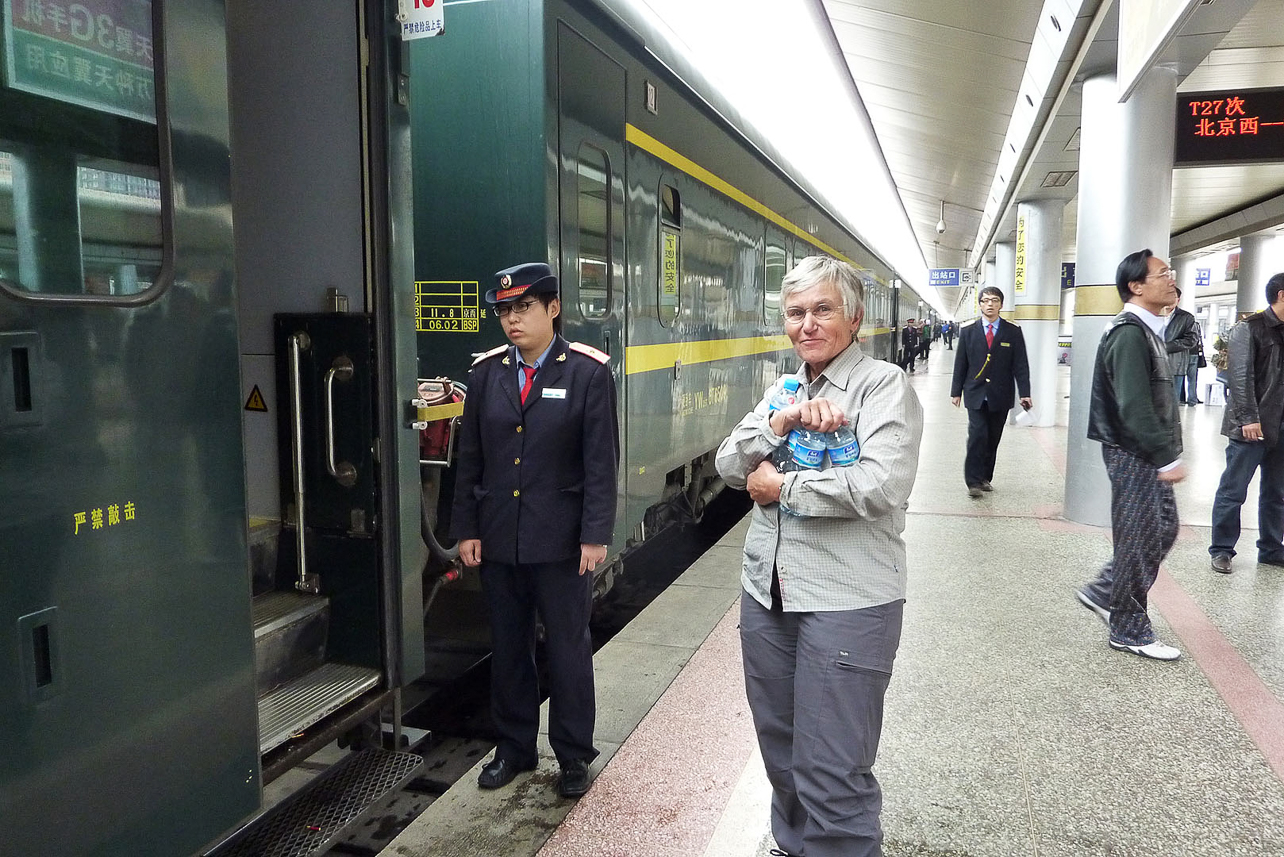 Buying water when the train stops on one of the few stations. Supervised by uniformed, not very glad, person.