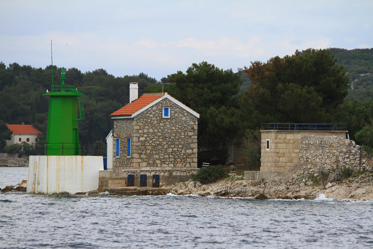 Green lighthouse at the entrance bay to Mali Losinj.