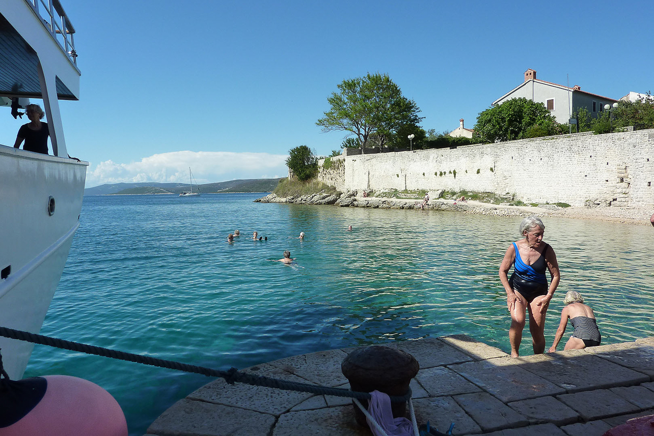 Taking a swim after the walk in Osor harbour.