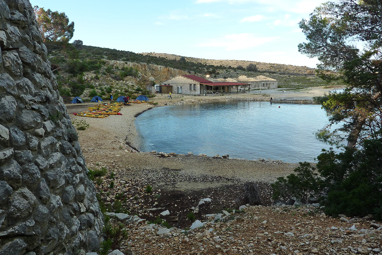 View over the bay with the ruins of some prison buildings. The prison kept political women prisoners, under the Tito regime, during 1948-1988.