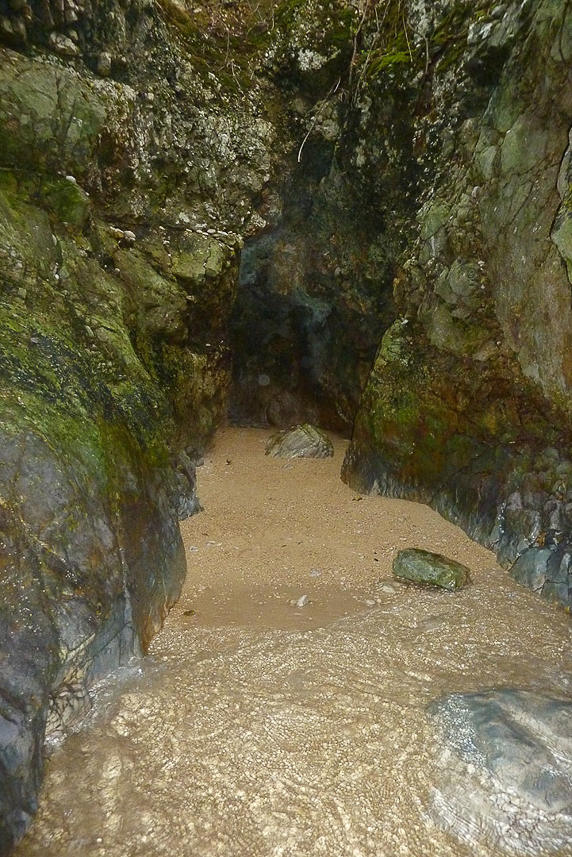 A sandy beach at the end of the cave.