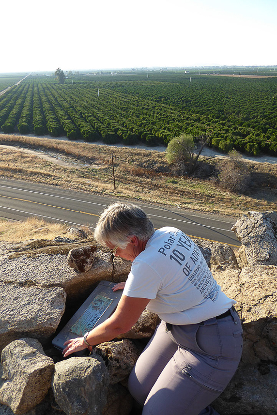 Geocaching with view over the orchards