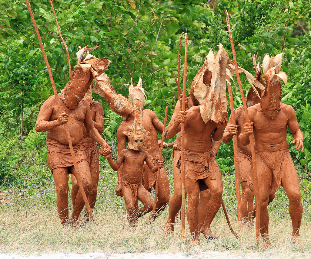 The mud men are coming from the forest, attacking the white women