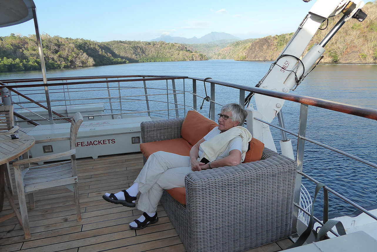 Relaxing on deck, arriving at Tufi fjords on the eastern PNG mainland.