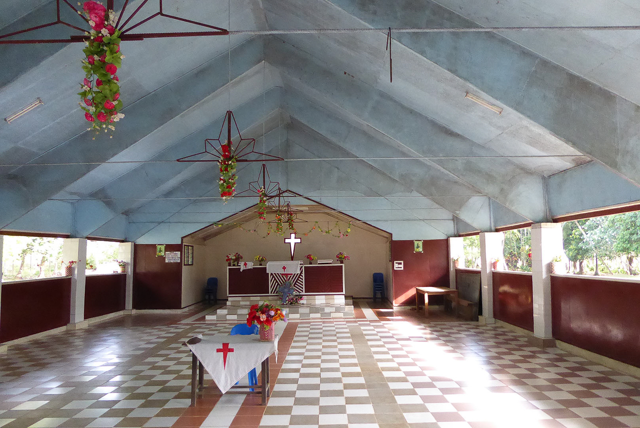 The church, lot of space and no chairs.