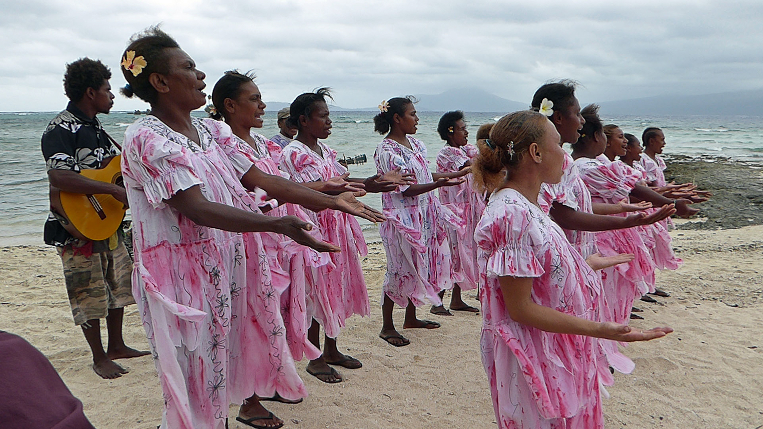 Welcoming choir (fairies) at a windy island of Ra, very difficult to come here but we managed after some tries. First tourist ship to visit in 12 years, so it had been sad for both us and them to miss.