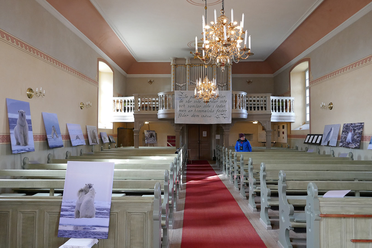 Inside Bjurum church with an Arctic photo exhibition by the priest Bengt-Åke Öhgren